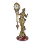 Tischuhr mit Frauenfigur, A TABLE CLOCK MYSTERIEUSE HELT BY A DRESSED WOMAN