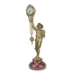 Tischuhr mit Jungenfigur, A TABLE CLOCK MYSTERIEUSE HELT BY A BOY