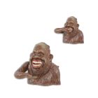 Spardose aus Gusseisen, A CAST IRON HAPPY SASQUATCH MECHANICAL MONEY BANK