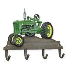 Gusseisen-Wandhaken mit Traktor, A CAST IRON GREEN TRACTOR COAT HOOK