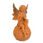 Gusseisenfigur Elfe auf Blumenball, rostfarben, A RUSTY CAST IRON FIGURINE OF A FAIRY SITTING ON BALL