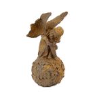 Gusseisenfigur Fee, Elfe, rostfarben, A RUSTY CAST IRON FIGURINE OF A FAIRY ON BALL