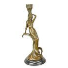 Figürlicher Kerzenhalter aus Bronze, A FIGURAL BRONZE CANDLESTICK